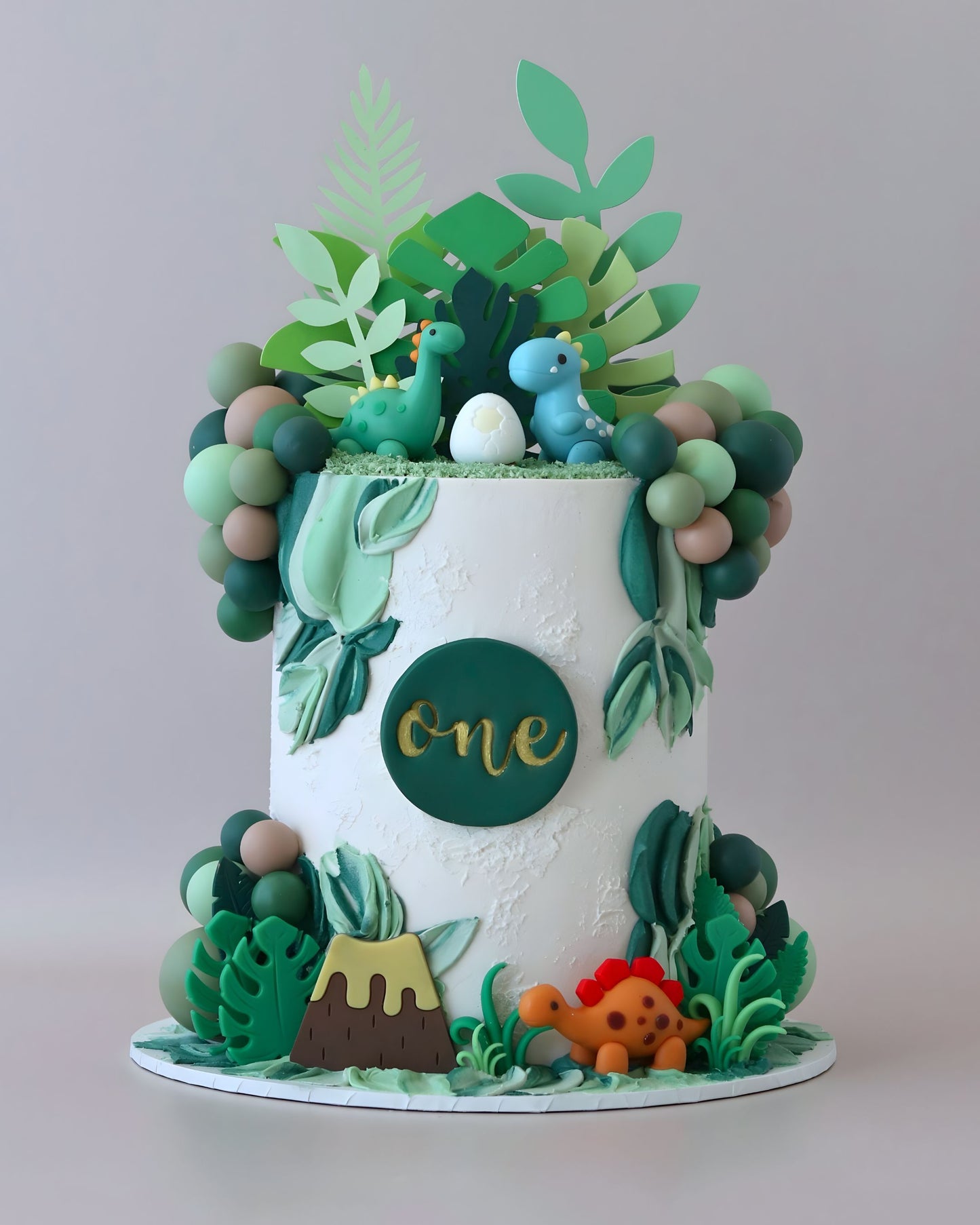 Green and White Cartoon Dinosaur Theme Celebration cake - Bel Bear Bakes
