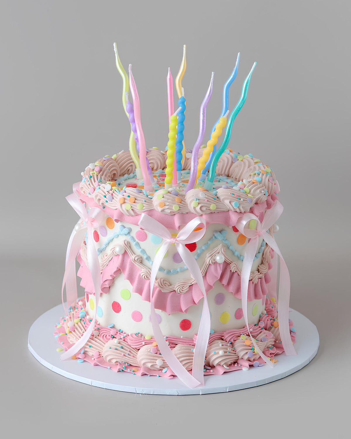 Pink & white multicolour confetti party cake with bows - Bel Bear Bakes