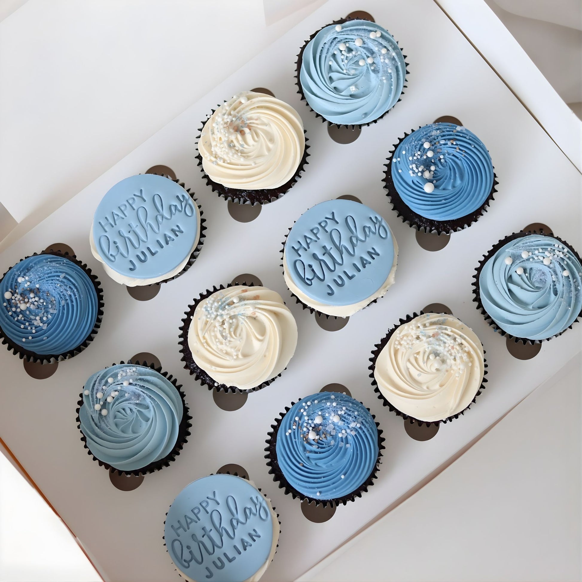 Blue and white Happy Happy Birthday cupcakes with custom name