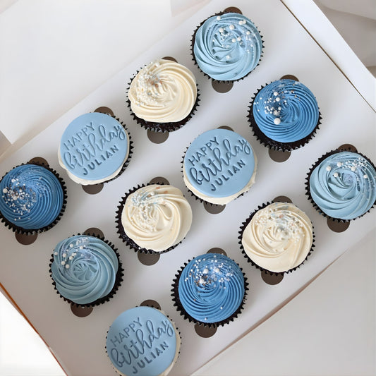 Blue and white Happy Happy Birthday cupcakes with custom name