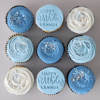 Blue and white Happy Happy Birthday cupcakes with custom name