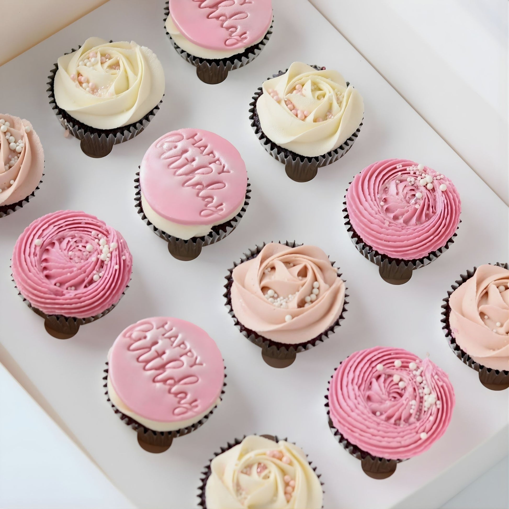 Pink and white Happy Happy Birthday cupcakes with custom name